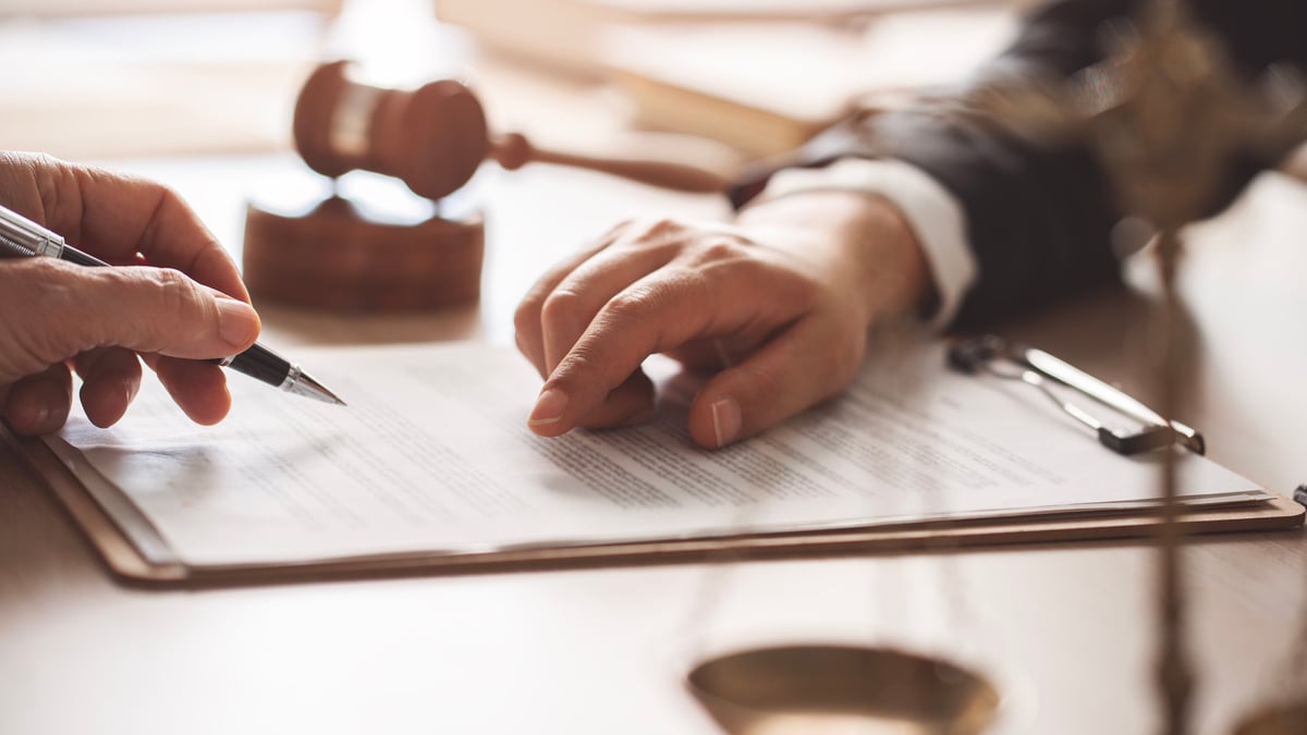 Legal documents and scales of justice representing title research